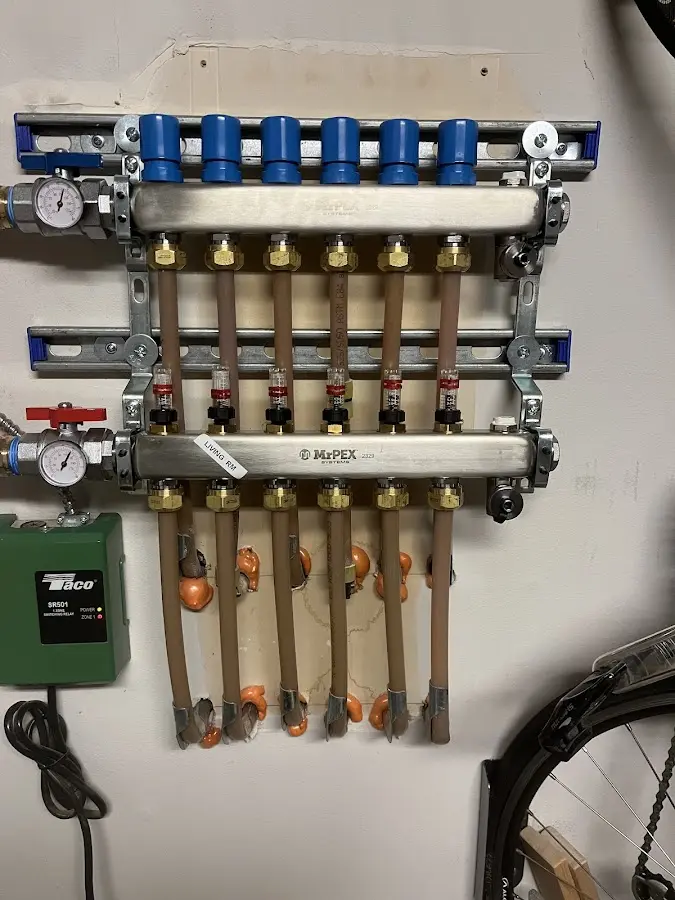 Plumber performing Water Heater Repair at a residential property in Lee